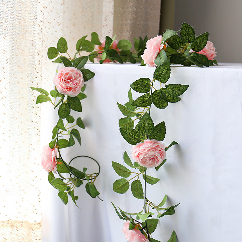 Faux flower garland for bedroom decor.