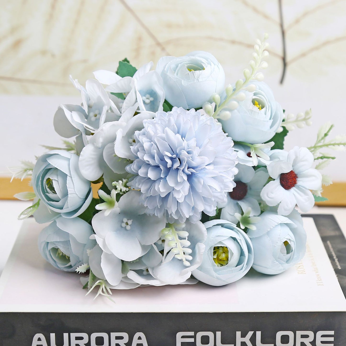 Realistic silk flower arrangement for home decor.