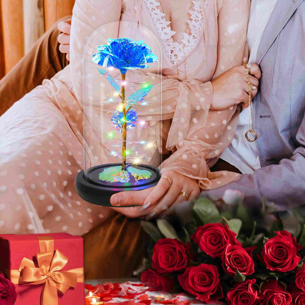Elegant blue rose with glowing LED lights in a glass dome, perfect for bedroom decor.