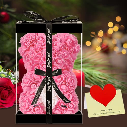 A finely detailed artificial rose teddy bear, made of premium faux roses, ideal for special moments and home decor.