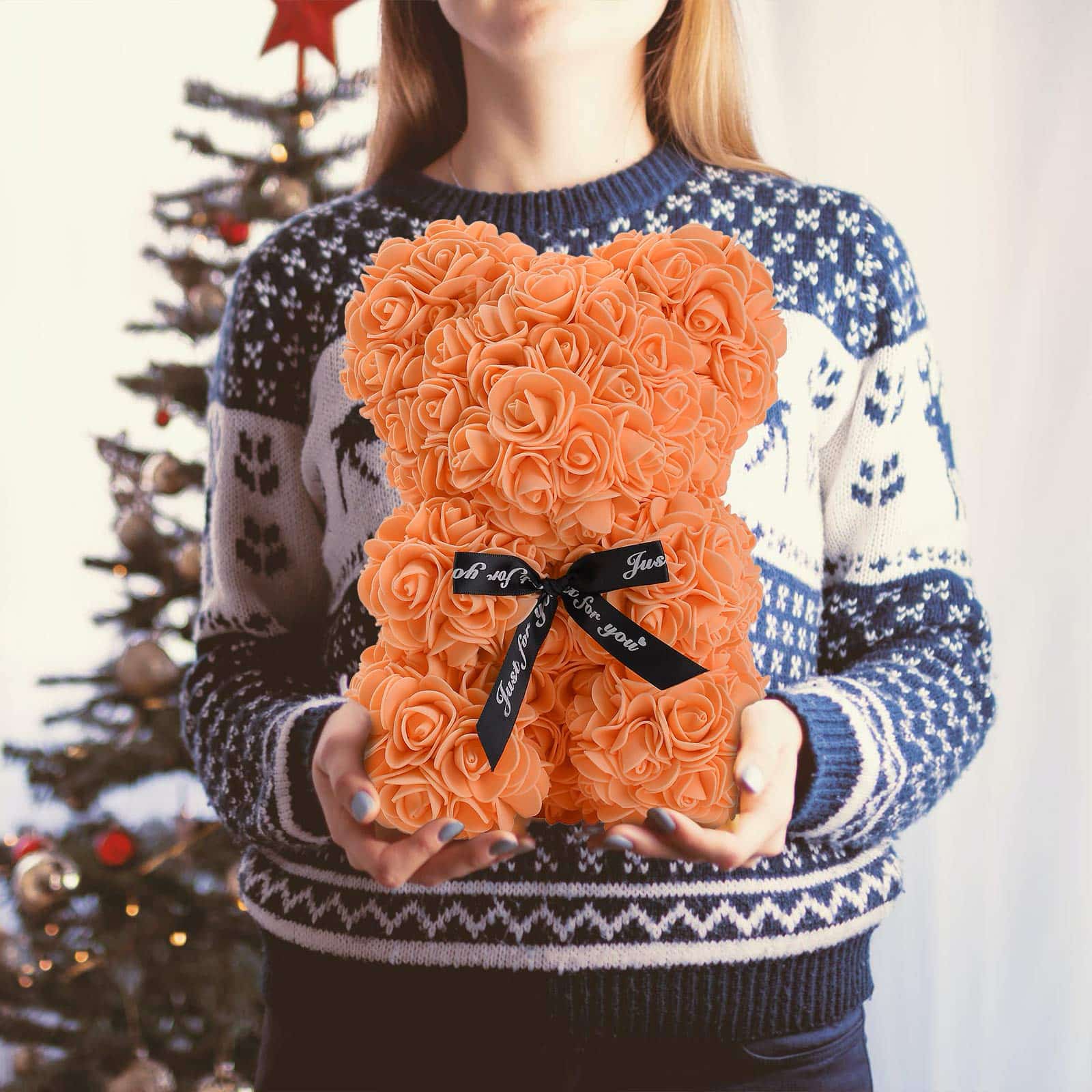 Artistic teddy bear made from artificial roses, perfect for expressing love and appreciation.