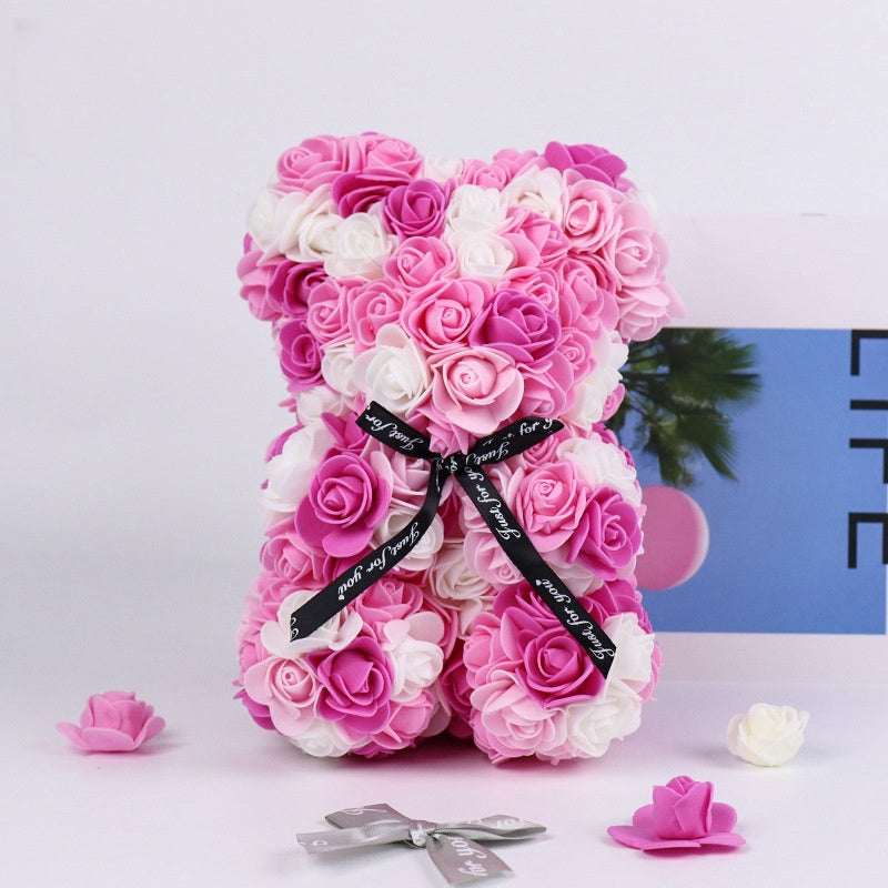 An intricate artificial rose teddy bear, designed to add charm and elegance to any room or as a special gift.