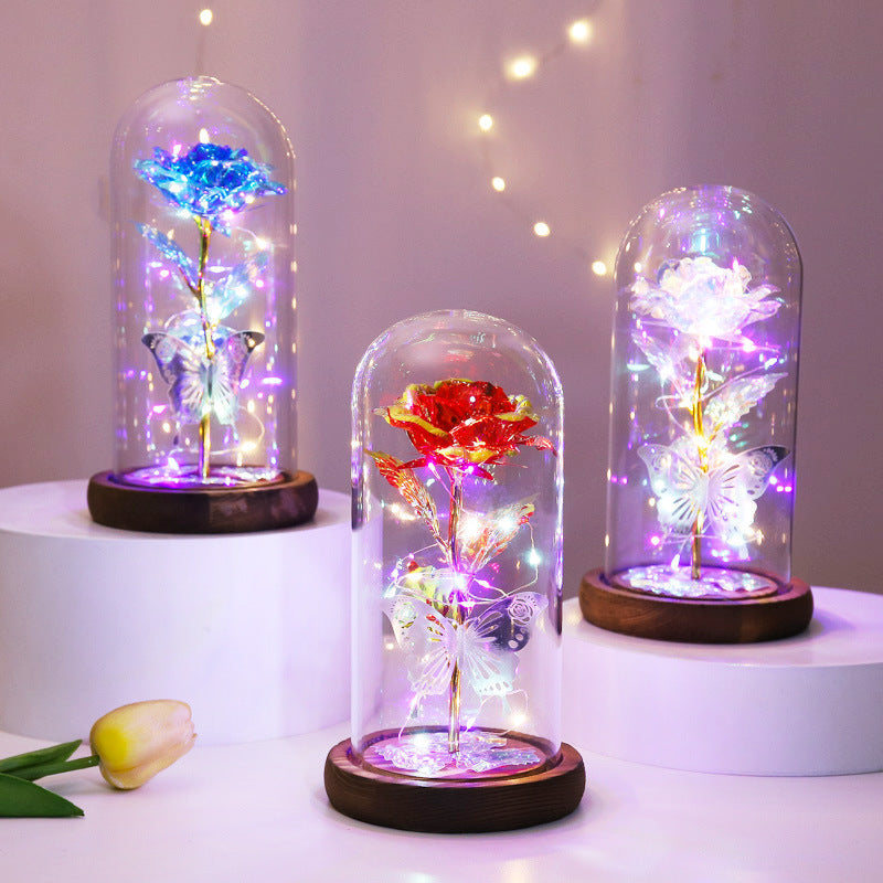 LED-lit pink rose under a glass dome, ideal for wedding or anniversary decorations.