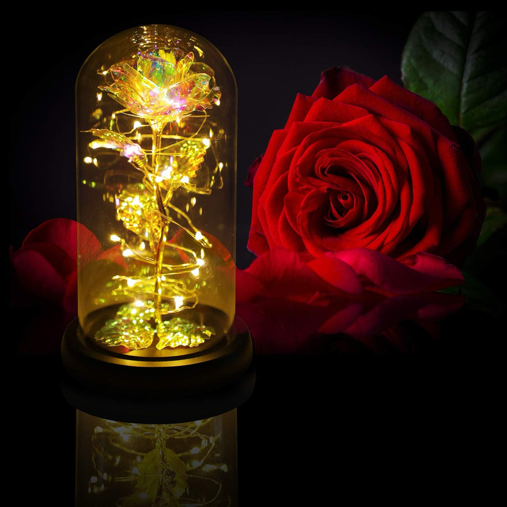 Glowing rainbow rose with LED lights in a glass dome, a stunning centerpiece.