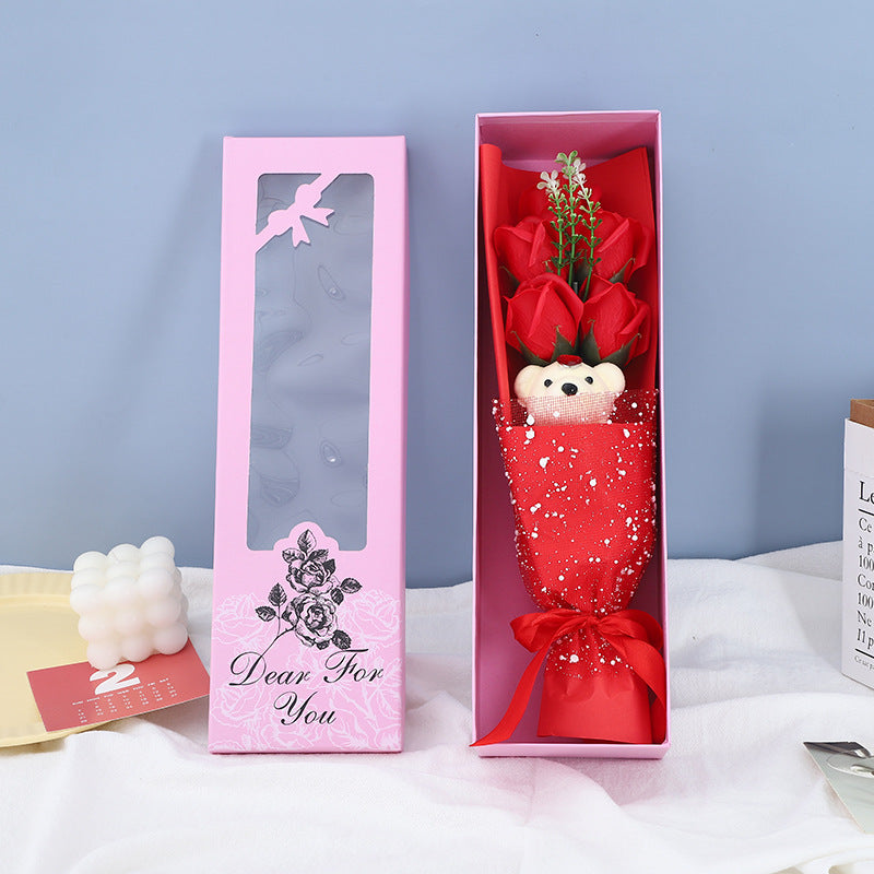 Handcrafted soap roses and a plush teddy bear, beautifully arranged in a box, making it a perfect romantic gesture.