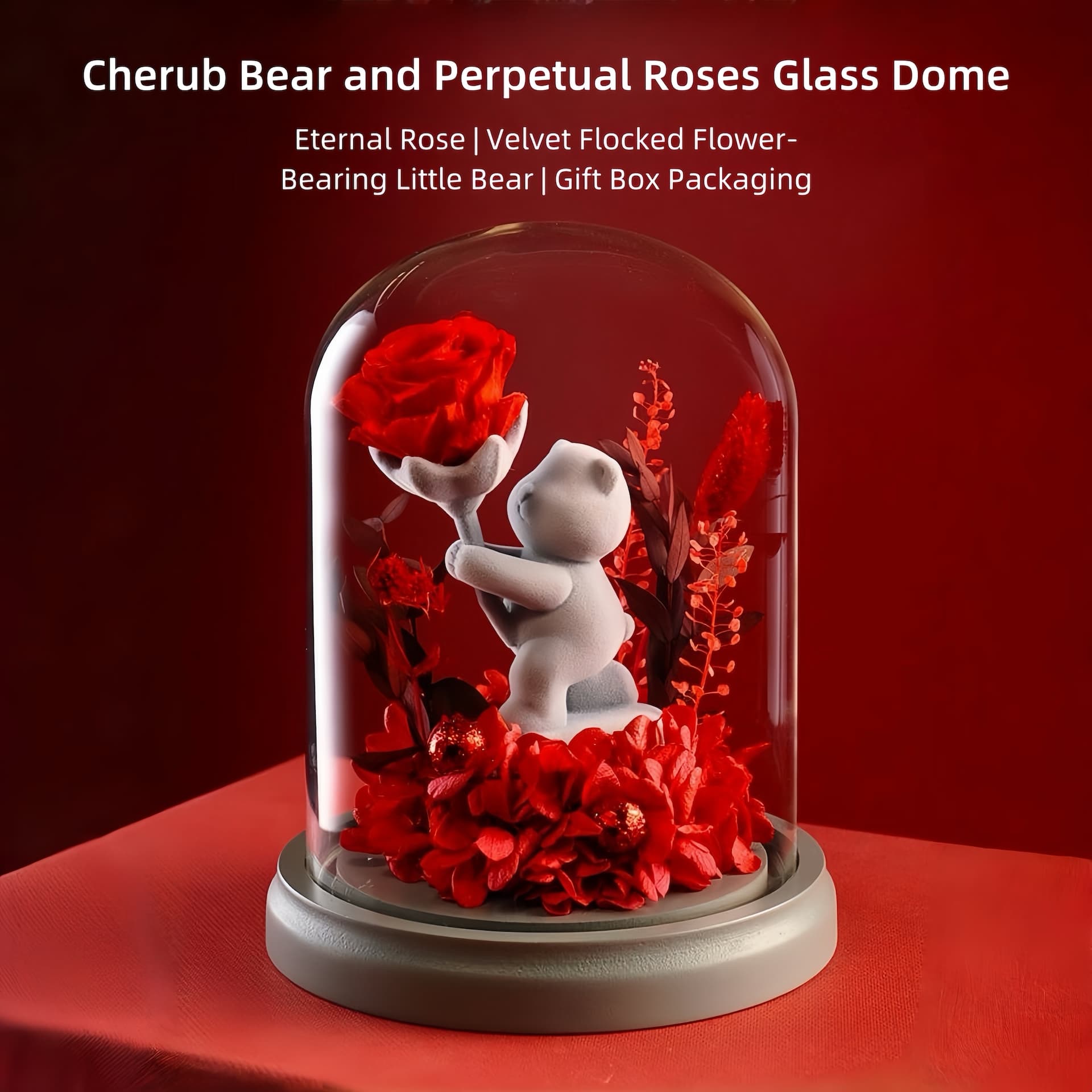 Romantic teddy bear in glass dome holding a single preserved rose, perfect for gifting on birthdays, anniversaries, and Valentine's Day.