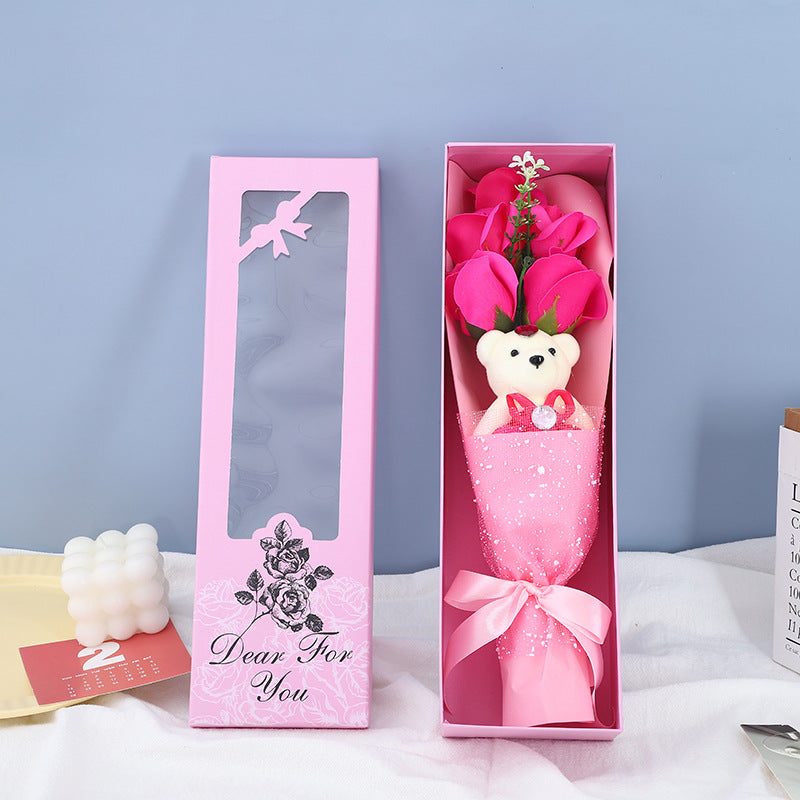 Aromatic soap roses with a cuddly teddy bear, packaged in a stylish box, perfect for memorable gifting occasions.