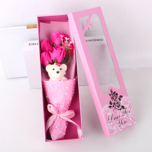 Handcrafted soap rose bouquet paired with a teddy bear, presented in a decorative box, perfect for anniversaries.