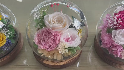 Glass dome flower gift for special occasions.